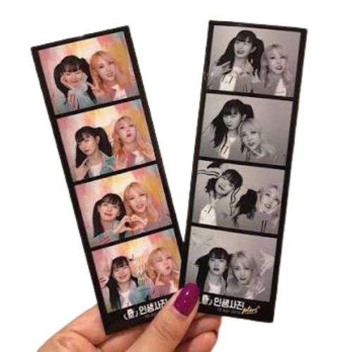 Additional photostrip prints held in hand—lifestyle example